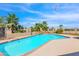 Inviting kidney-shaped pool with brick coping and waterfall feature at 15234 N 19Th Pl, Phoenix, AZ 85022