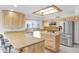 Spacious kitchen with granite countertops, island, and stainless steel appliances at 15234 N 19Th Pl, Phoenix, AZ 85022