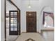 Bright entryway with wood door and tile floor at 15234 N 19Th Pl, Phoenix, AZ 85022
