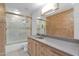 Bathroom features a shower/tub combo, vanity with granite countertop, and marble tile at 15234 N 19Th Pl, Phoenix, AZ 85022