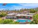Aerial view of home, pool, and surrounding landscape at 15234 N 19Th Pl, Phoenix, AZ 85022