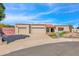 Two-car garage, attractive landscaping, and stone accents at 15234 N 19Th Pl, Phoenix, AZ 85022