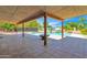 Spacious covered patio with fire pit overlooking the pool at 15234 N 19Th Pl, Phoenix, AZ 85022