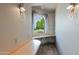 Home office with built-in desk and arched window at 15234 N 19Th Pl, Phoenix, AZ 85022