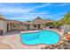 Inviting kidney-shaped pool with brick coping, mountain views, and a covered patio at 15234 N 19Th Pl, Phoenix, AZ 85022
