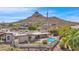 Aerial view showcasing home's pool and mountain backdrop at 15234 N 19Th Pl, Phoenix, AZ 85022