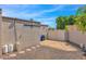 Backyard with gravel, storage shed, and gated access at 15234 N 19Th Pl, Phoenix, AZ 85022