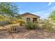 Home's backyard, featuring gravel landscaping and a covered patio at 259 W Satinka Dr, San Tan Valley, AZ 85140