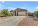 Single-story home with a two-car garage and well-maintained landscaping at 259 W Satinka Dr, San Tan Valley, AZ 85140