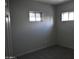 Simple bedroom with neutral gray walls and carpet flooring at 17836 N 21St St, Phoenix, AZ 85022