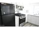 Updated kitchen with white cabinets and stainless steel range at 17836 N 21St St, Phoenix, AZ 85022