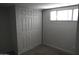 Bedroom with double door closet and neutral gray walls at 17836 N 21St St, Phoenix, AZ 85022