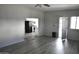 Living room with gray walls, wood-look floors, and an open floor plan at 17836 N 21St St, Phoenix, AZ 85022