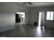 Living room with gray walls, wood-look floors, and an open floor plan at 17836 N 21St St, Phoenix, AZ 85022