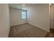 Bright bedroom with neutral carpeting and large window at 4244 E Bradford Ave, San Tan Valley, AZ 85140