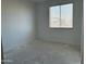 Simple bedroom with new flooring and a window with blinds at 4244 E Bradford Ave, San Tan Valley, AZ 85140