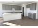 Modern kitchen with gray cabinets, white countertops, and an island at 4244 E Bradford Ave, San Tan Valley, AZ 85140