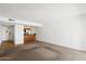 Spacious living room with open concept layout and carpeted floors at 3313 N 68Th St # 203, Scottsdale, AZ 85251