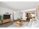 Living room with open layout to kitchen area at 3313 N 68Th St # 203, Scottsdale, AZ 85251