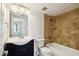 Bathroom with updated vanity, bathtub, and decorative tile at 3313 N 68Th St # 203, Scottsdale, AZ 85251
