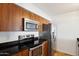 Sleek kitchen with stainless steel appliances and wood cabinets at 3313 N 68Th St # 203, Scottsdale, AZ 85251