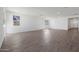 Spacious living room with wood-look tile flooring at 4034 W Nora W Dr, San Tan Valley, AZ 85144