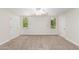 Spacious bedroom with two windows, ceiling fan, and neutral carpeting at 930 Leisure World --, Mesa, AZ 85206