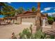 Front exterior view of a charming single-story home with a two-car garage at 930 Leisure World --, Mesa, AZ 85206