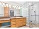 Bathroom with granite vanity, large shower, and glass block accents at 930 Leisure World --, Mesa, AZ 85206