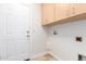 Laundry room with built-in cabinets and utility hookups at 930 Leisure World --, Mesa, AZ 85206