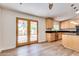 Bright kitchen with wood cabinets and view to backyard at 930 Leisure World --, Mesa, AZ 85206