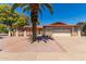 Front exterior view of a charming single-story home with a two-car garage at 930 Leisure World --, Mesa, AZ 85206