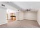 Living room with carpet, ceiling fan and kitchen access at 930 Leisure World --, Mesa, AZ 85206