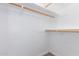 Spacious closet with wooden hanging rods and shelving at 930 Leisure World --, Mesa, AZ 85206