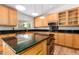 Modern kitchen with granite island and stainless steel appliances at 930 Leisure World --, Mesa, AZ 85206
