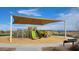 Modern playground with two slides and shade structure at 4244 E Bradford Ave, San Tan Valley, AZ 85140