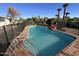 Refreshing kidney-shaped pool with safety fence at 10125 W Chaparral Dr, Sun City, AZ 85373