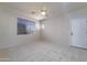 Spacious bedroom with neutral carpeting and a large window at 7855 E Kramer St, Mesa, AZ 85207