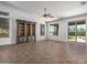 Living room with large windows, backyard view, and ceiling fan at 7855 E Kramer St, Mesa, AZ 85207