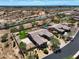 Aerial view of house with pool and landscaped yard; desert landscape in background at 7855 E Kramer St, Mesa, AZ 85207