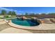 Inviting pool with a waterfall feature and spacious patio at 7855 E Kramer St, Mesa, AZ 85207