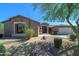 Single story home with stone accents and mature trees at 7855 E Kramer St, Mesa, AZ 85207