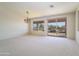 Bright dining room with sliding glass doors and backyard access at 7855 E Kramer St, Mesa, AZ 85207