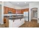 Spacious kitchen featuring granite countertops, modern appliances, and ample wood cabinetry at 7855 E Kramer St, Mesa, AZ 85207