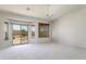 Main bedroom with carpet, sliding glass doors to patio and pool at 7855 E Kramer St, Mesa, AZ 85207