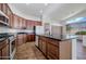 Modern kitchen with dark wood cabinets and granite countertops at 7855 E Kramer St, Mesa, AZ 85207