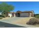 Single story home with two car garage and desert landscaping at 7855 E Kramer St, Mesa, AZ 85207
