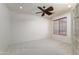 Bright office space with carpeted floors and ceiling fan at 7855 E Kramer St, Mesa, AZ 85207