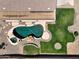 Aerial view of kidney-shaped pool with spa and surrounding landscaping at 7855 E Kramer St, Mesa, AZ 85207