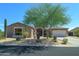 Beautiful one-story home with stone accents and lush landscaping at 7855 E Kramer St, Mesa, AZ 85207
